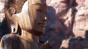 Statue of a buddha among Sedona's red rocks